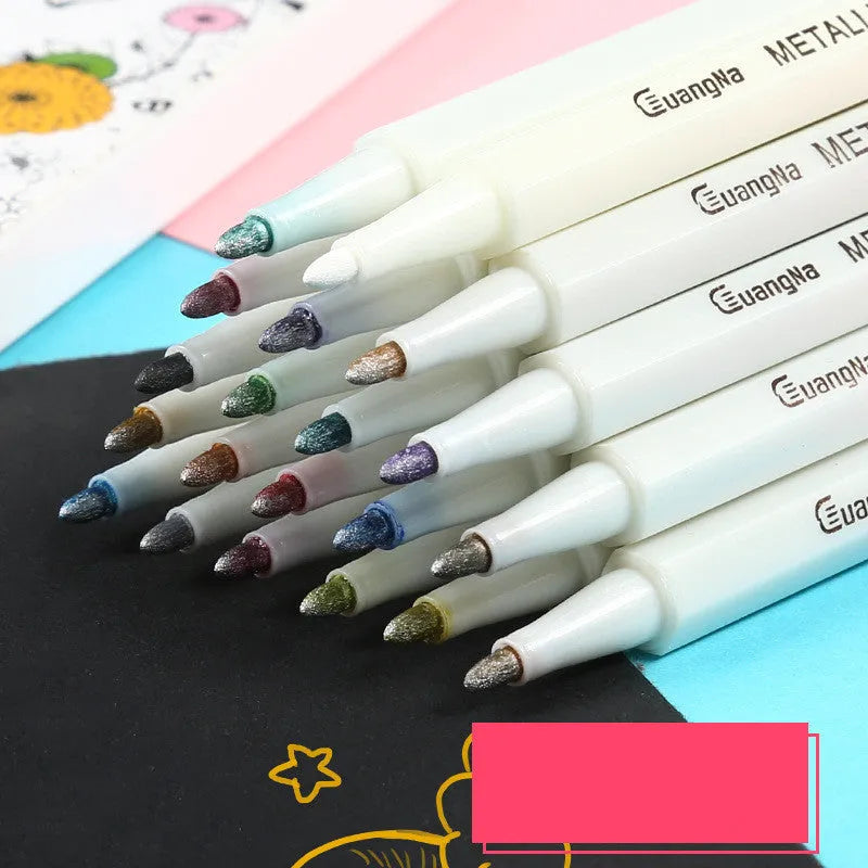 Black card album containing a set of colour metal pens with plastic shells for office stationery.