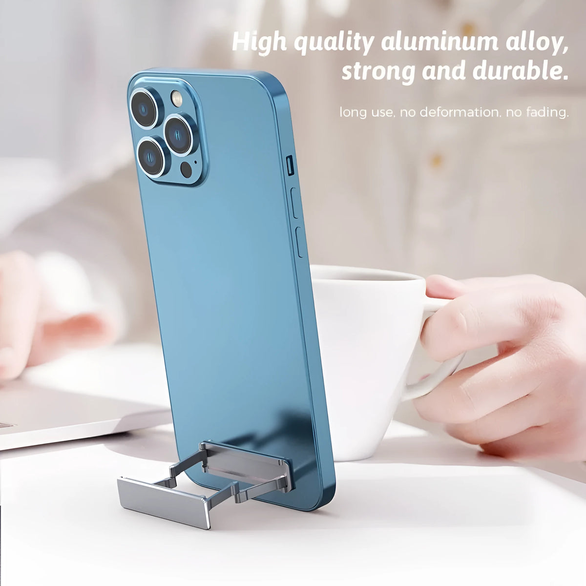 Aluminium alloy foldable mobile phone bracket with back sticker in silver, light gray, and black on a white background