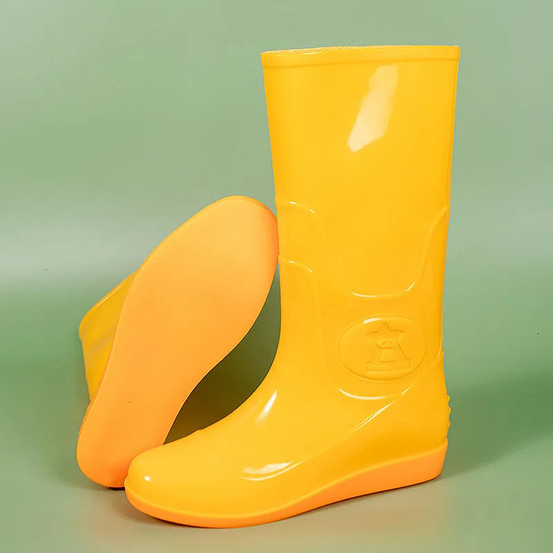 Plastic high tube rain boots in white colour with flat heel and round toe design
