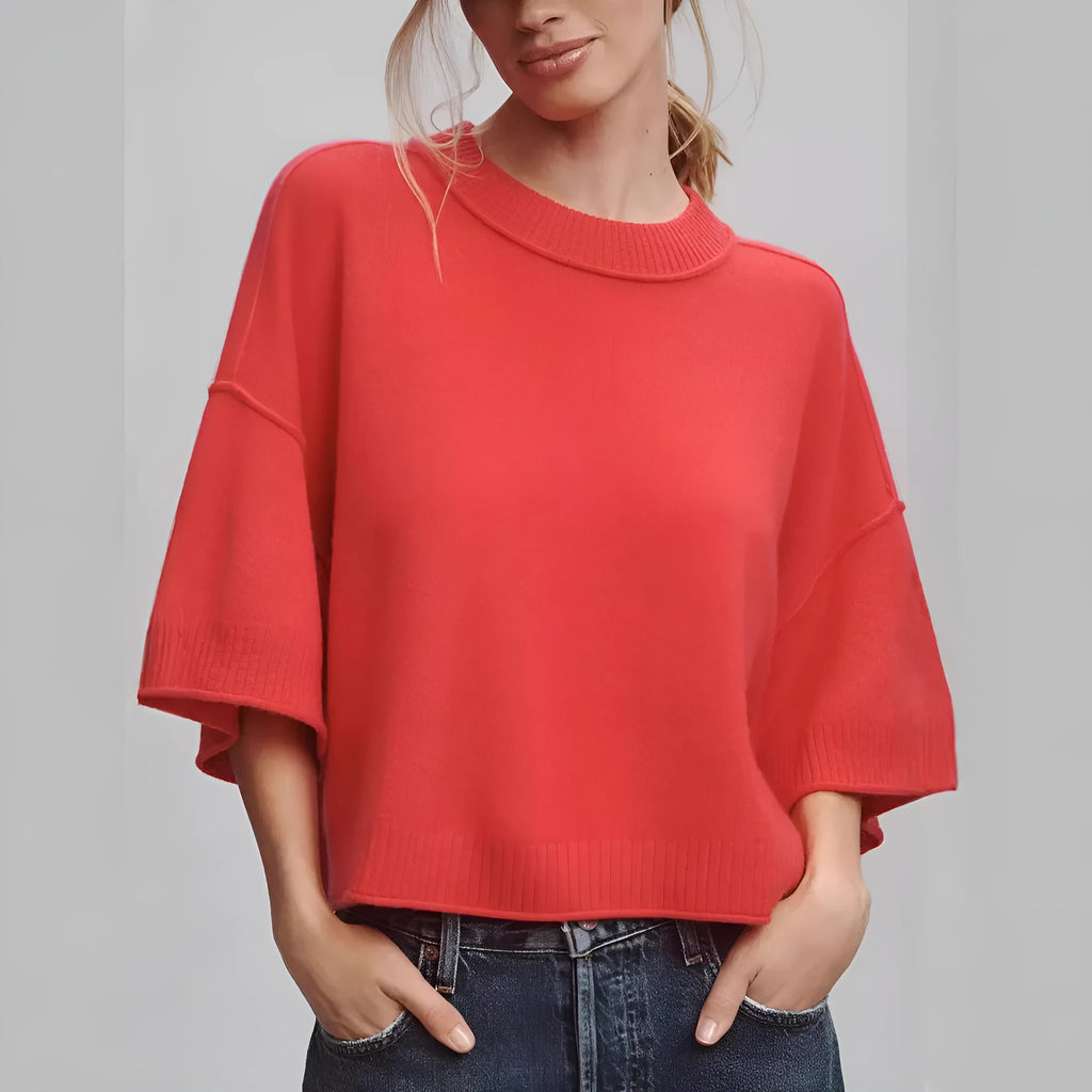 Red cropped t-shirt with exposed navel design and short sleeves on mannequin