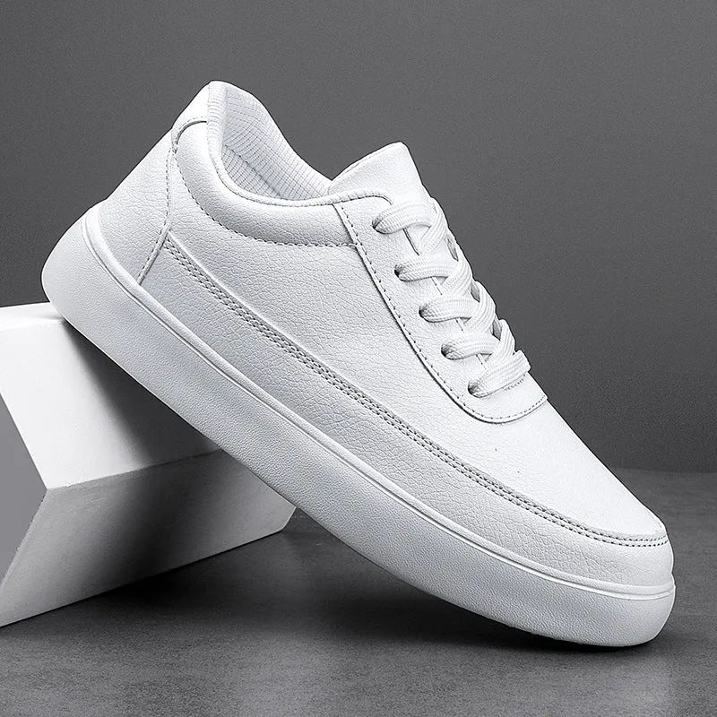 Women's gold leather lace-up flat casual shoes on a white background.