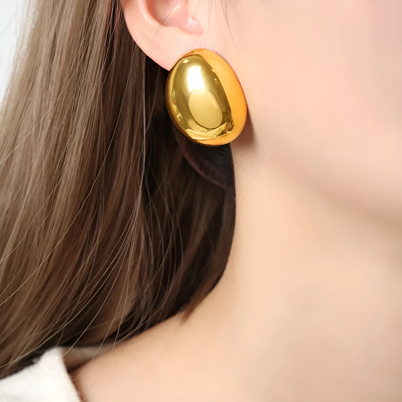 Geometric women's ear studs with a glazed gold electroplated finish and line detailing.