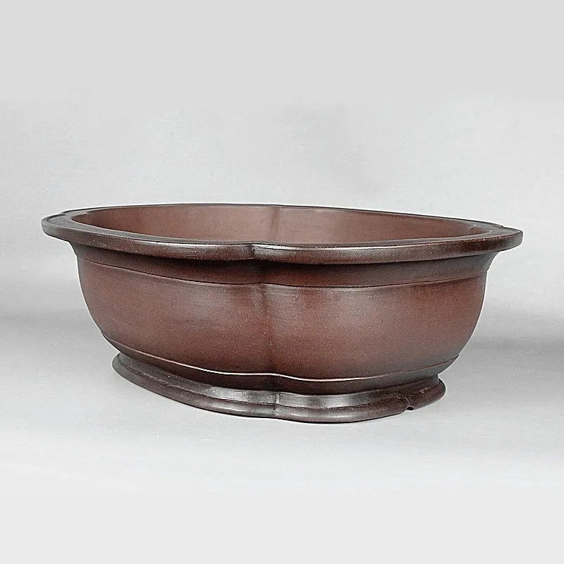 Handmade antique Chinese style purple clay flowerpot shaped like a crabapple fruit.