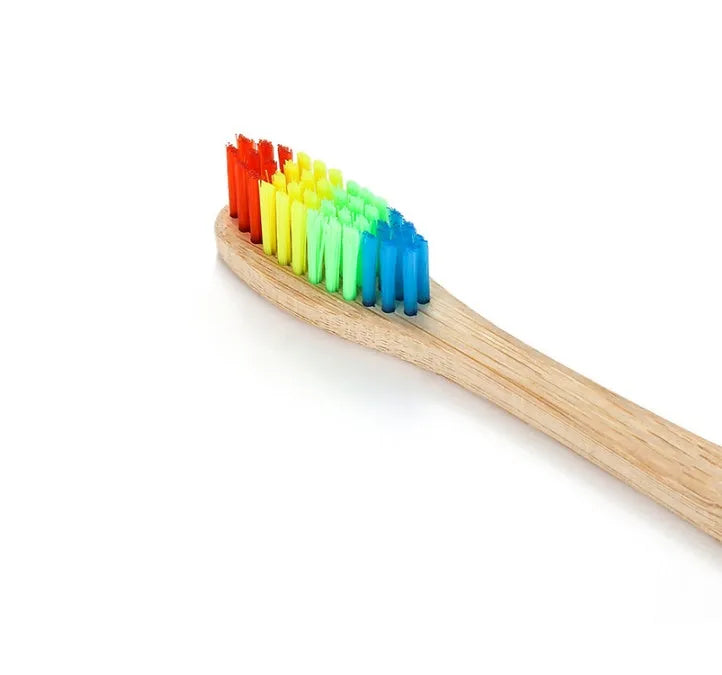 Rainbow bamboo toothbrush with natural biodegradable handle for eco-friendly oral care