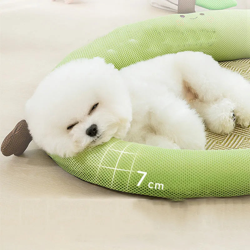 Green pet cooling mat with a raised fruit-shaped backrest for dogs and cats.