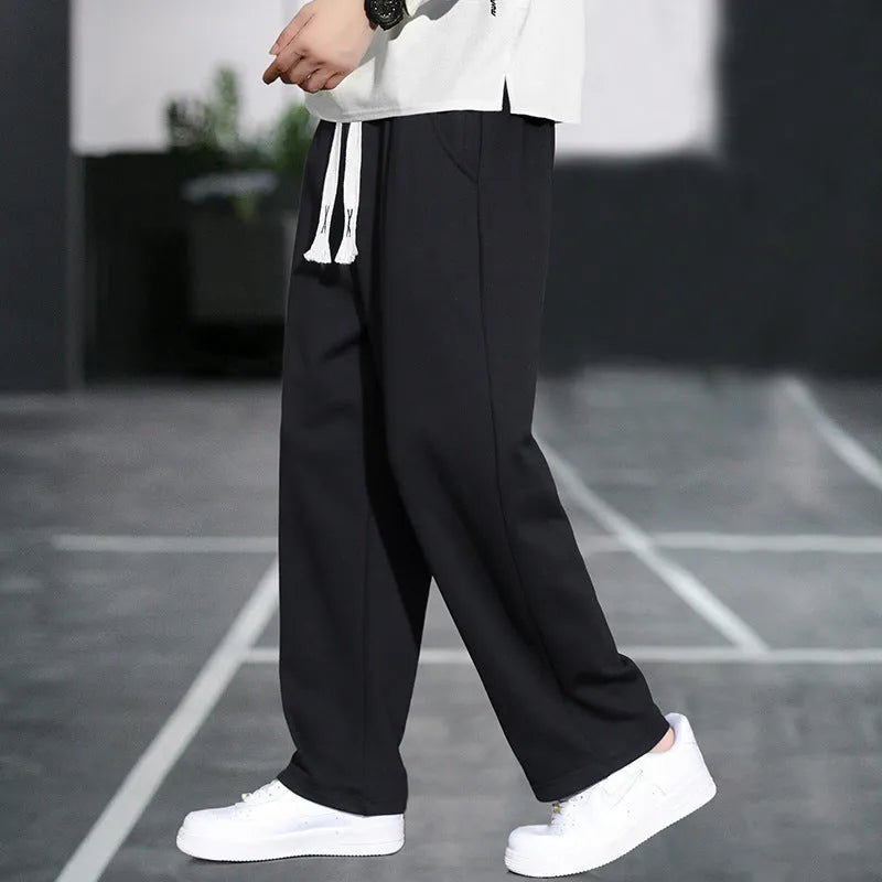 Men's grey casual bamboo fibre trousers with a high waist and multiple pockets.