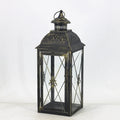 European-style black wrought iron floor-standing storm lantern with tempered glass panels.