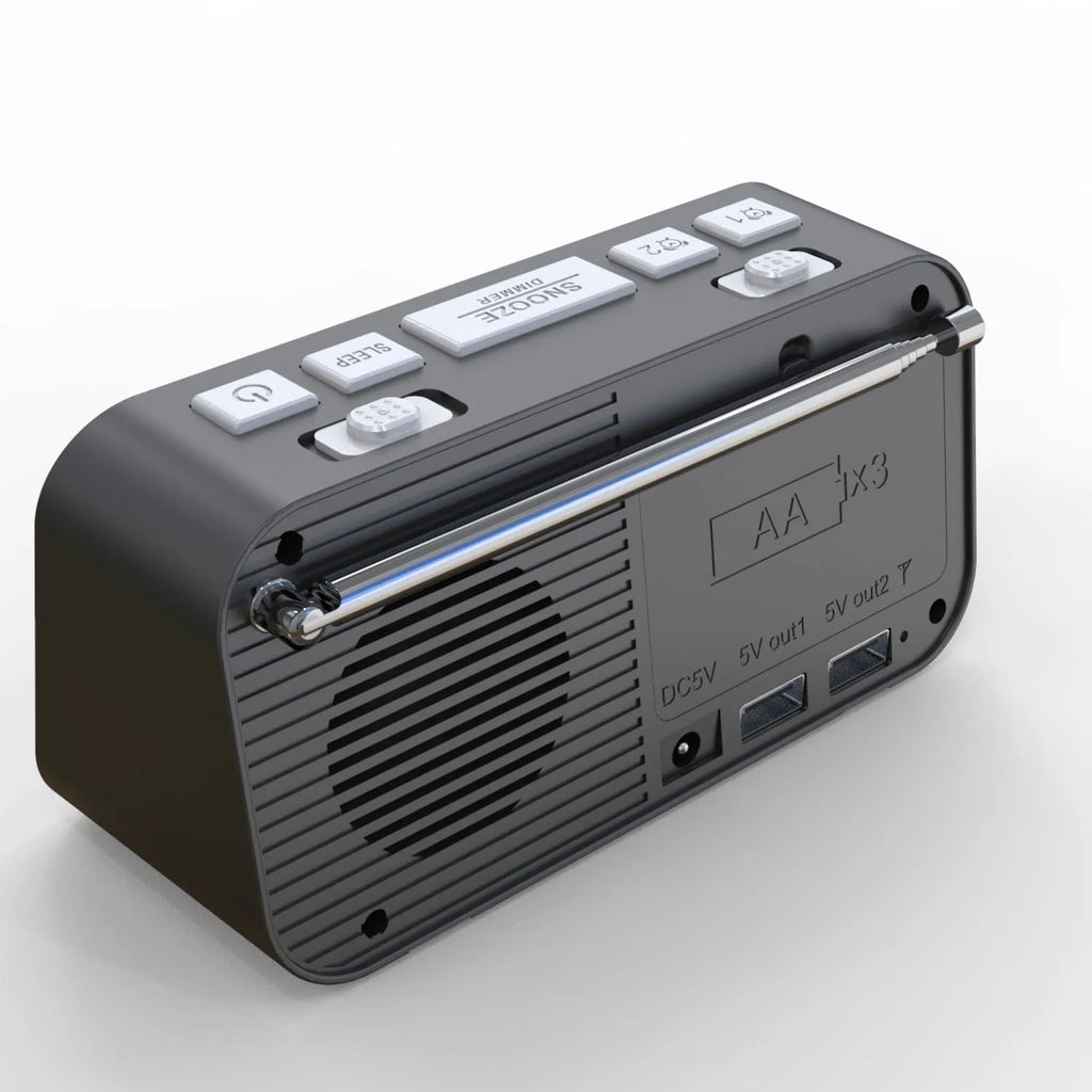 Black DAB bedside alarm clock with large LED display, pigtail antenna, and USB ports on the side.