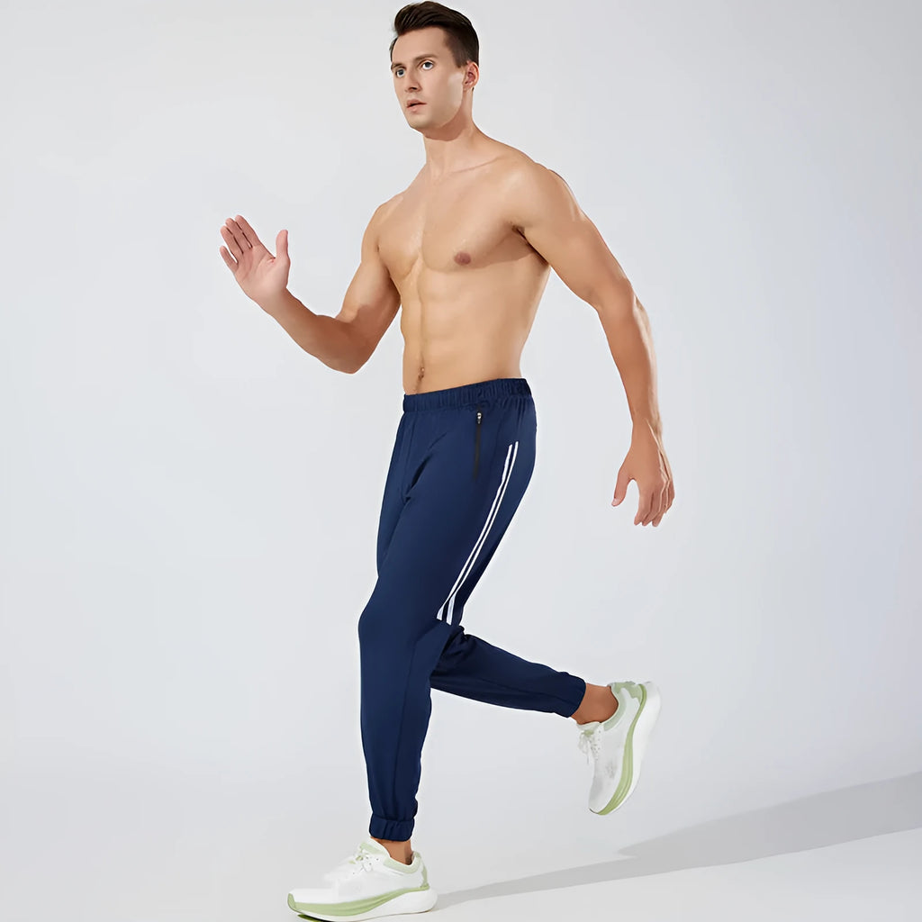 Men's black polyester running trousers with mid waist design and full length legs for exercise