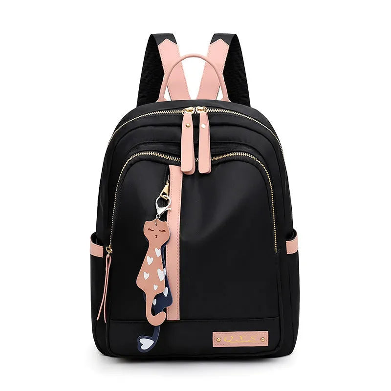 Black nylon women's casual backpack with internal pockets and double shoulder straps.