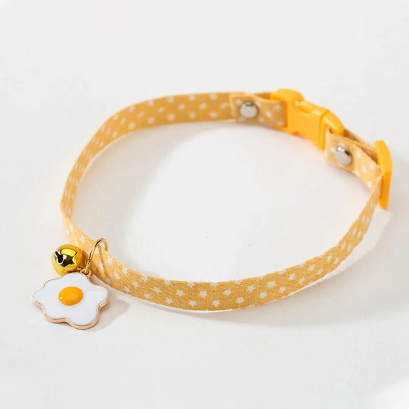 Adjustable cat collar with bell and bow tie decoration on small dog