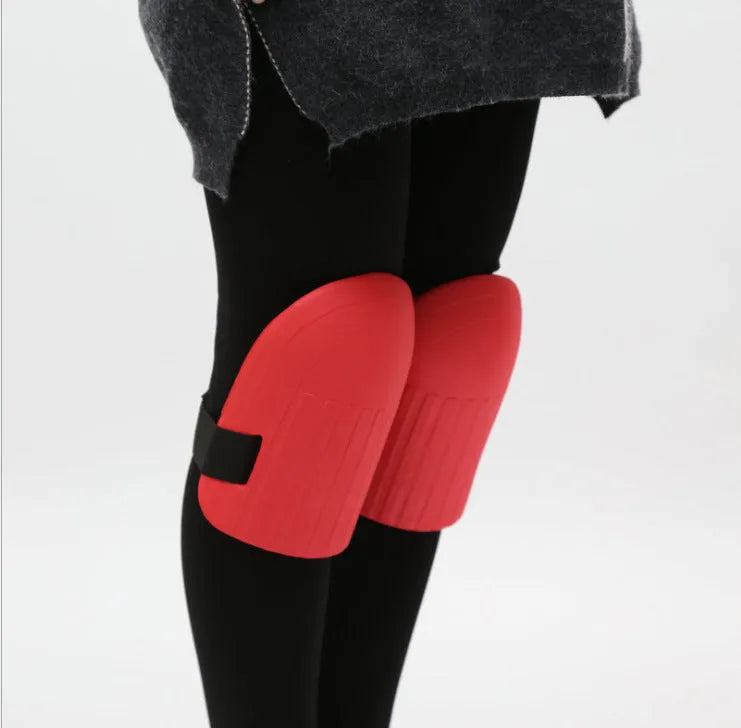 A pair of black EVA foam knee pads for gardening, showing their size and simple design.