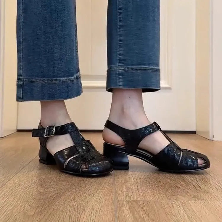 Women's apricot buckle shoes with round toe, two-layer cowhide upper, and rubber sole on a plain background