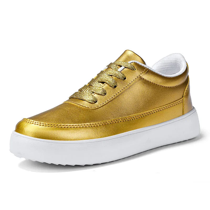 Women's gold leather lace-up flat casual shoes on a white background.