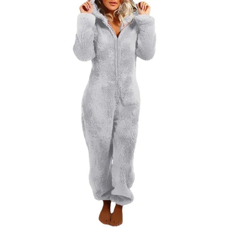 Fleece-lined thickened furry hooded jumpsuit pajama with zipper, loose fit, warm red colour lounging on bed