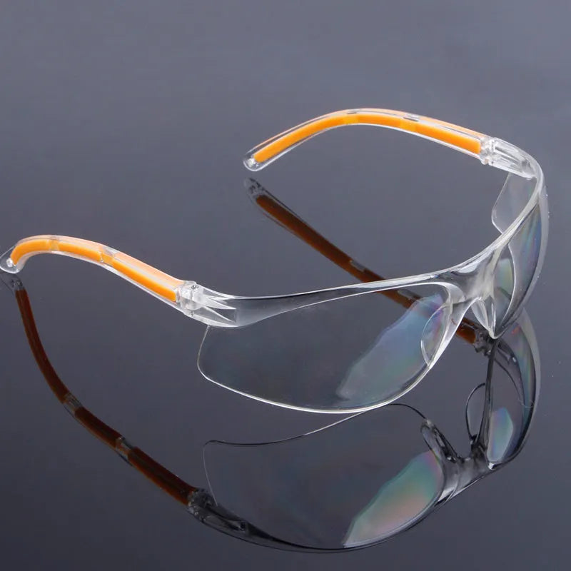 Transparent polycarbonate safety goggles with yellow tint lenses for laboratory and welding work