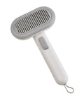 Large light grey pet grooming comb with stainless steel teeth and integrated tools for cat and dog hair removal.