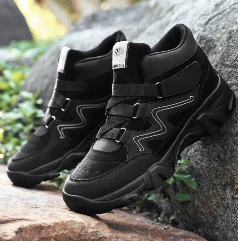 Men's black synthetic leather casual shoes with a slip-resistant sole on a plain background.