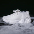Women's white low-top sports shoes with a woven upper and thick rubber sole.