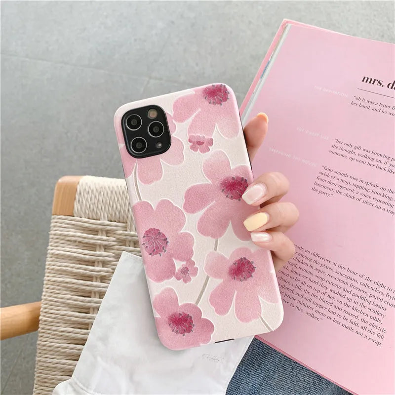 Pink soft rubber iPhone case with Japanese-Korean design showing lanyard hole