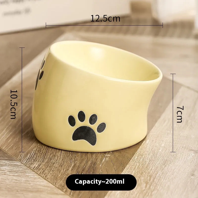 Ceramic cat bowl with high foot design and oblique mouth in cat's paw pattern