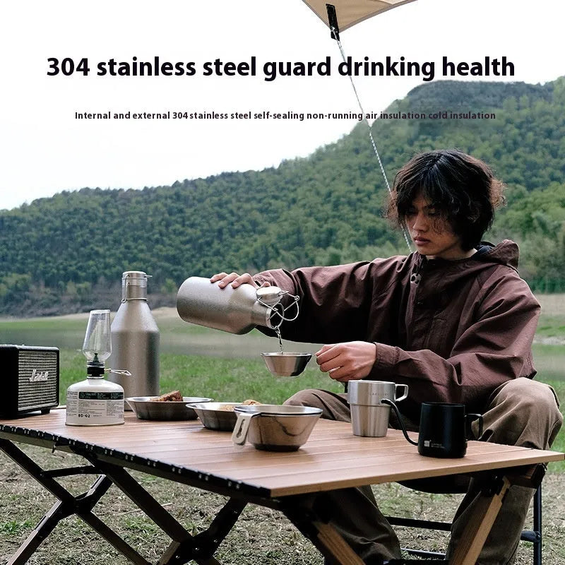 Large stainless steel thermal pot with carrying handle for outdoor camping and hiking use