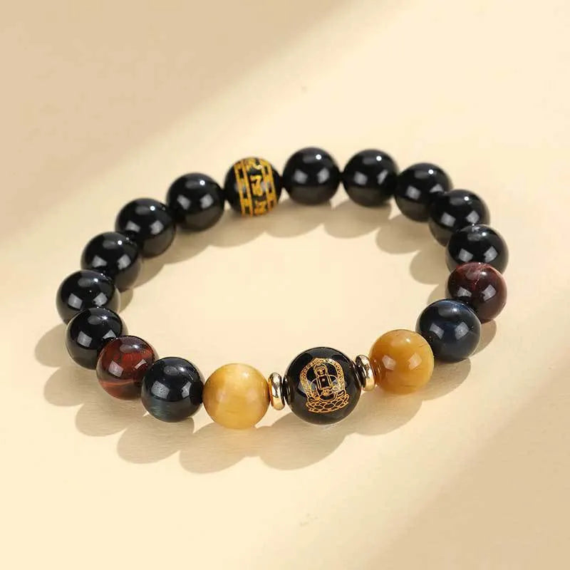 Handmade black agate bracelet with zodiac animal charms and gold tiger eye beads on wrist