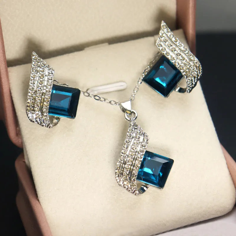 Fashion jewellery set showing alloy pendant necklace with cross chain and matching glass ear studs
