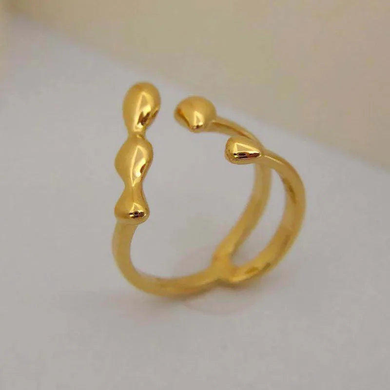 Brass opening ring with spherical elements in gold or silver finish, adjustable women's fashion jewellery