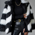A minimalist faux fur coat with contrast lapels and a detachable fur collar, shown in picture colour.