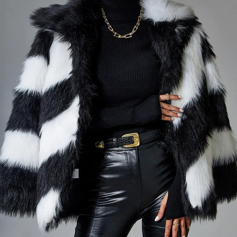 A minimalist faux fur coat with contrast lapels and a detachable fur collar, shown in picture colour.