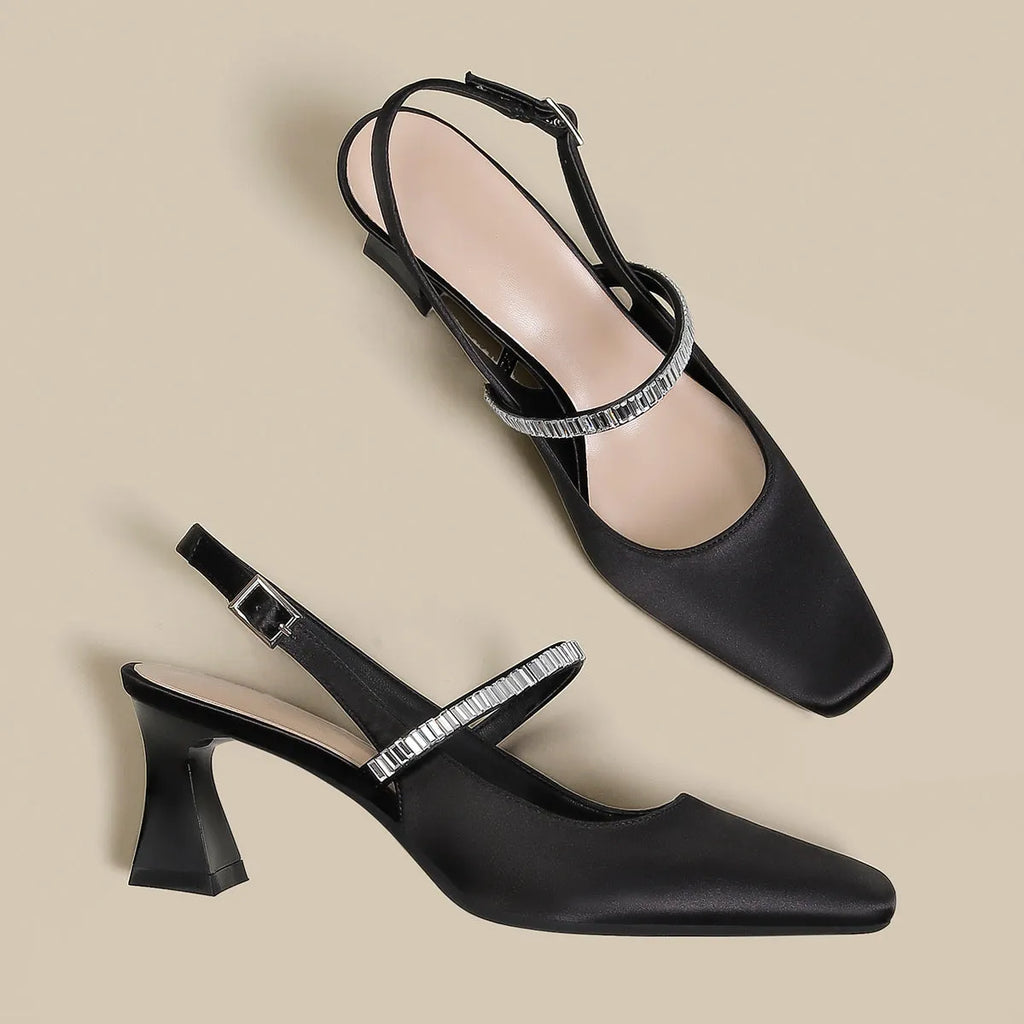 Black women's stiletto sandals with pointed toe and single ankle buckle strap