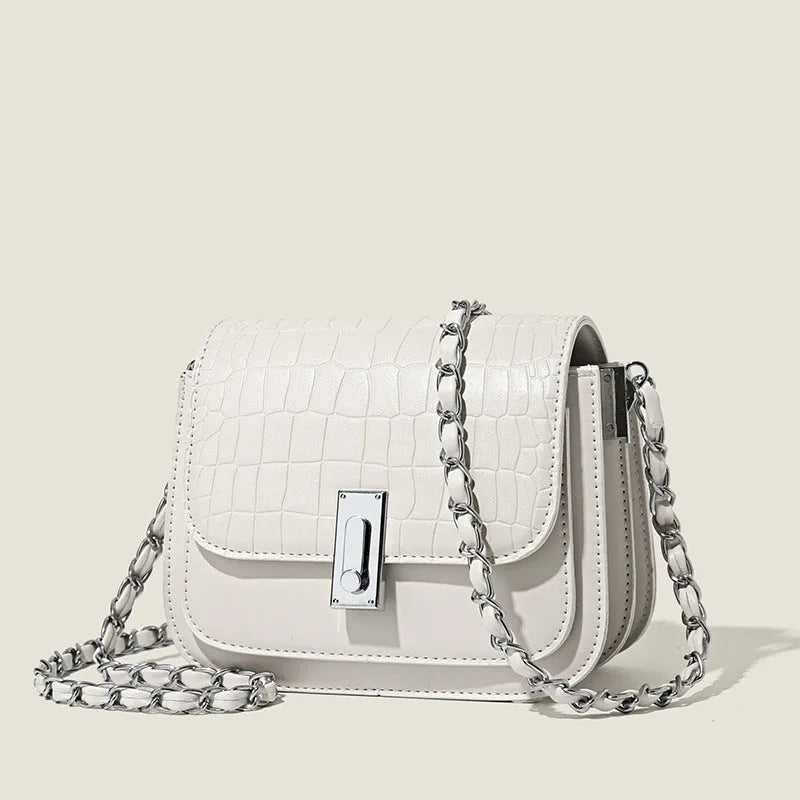 Women's soft PU chain crossbody shoulder bag in black, showing internal phone pocket and outer compartments.