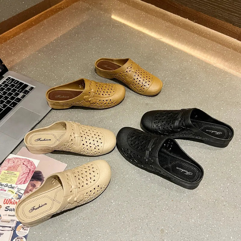 Adult flat toe box slippers in PVC with hollow-out design and faux fur collar.