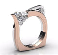 Rose gold electroplated geometric alloy ring with zircon stone inlays on a white background.
