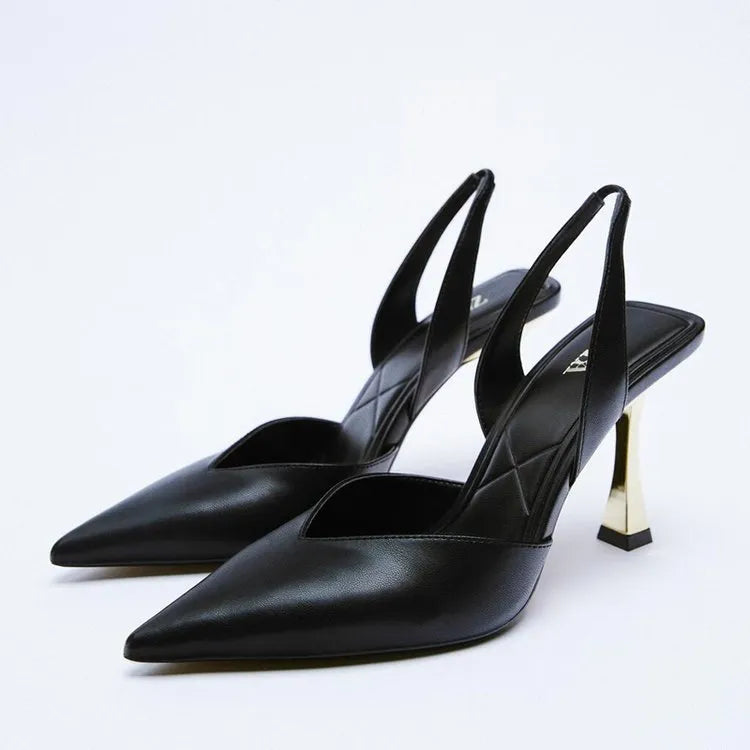 Women's pointed-toe patent leather high heels in apricot and black, showing shallow-cut vamp design.