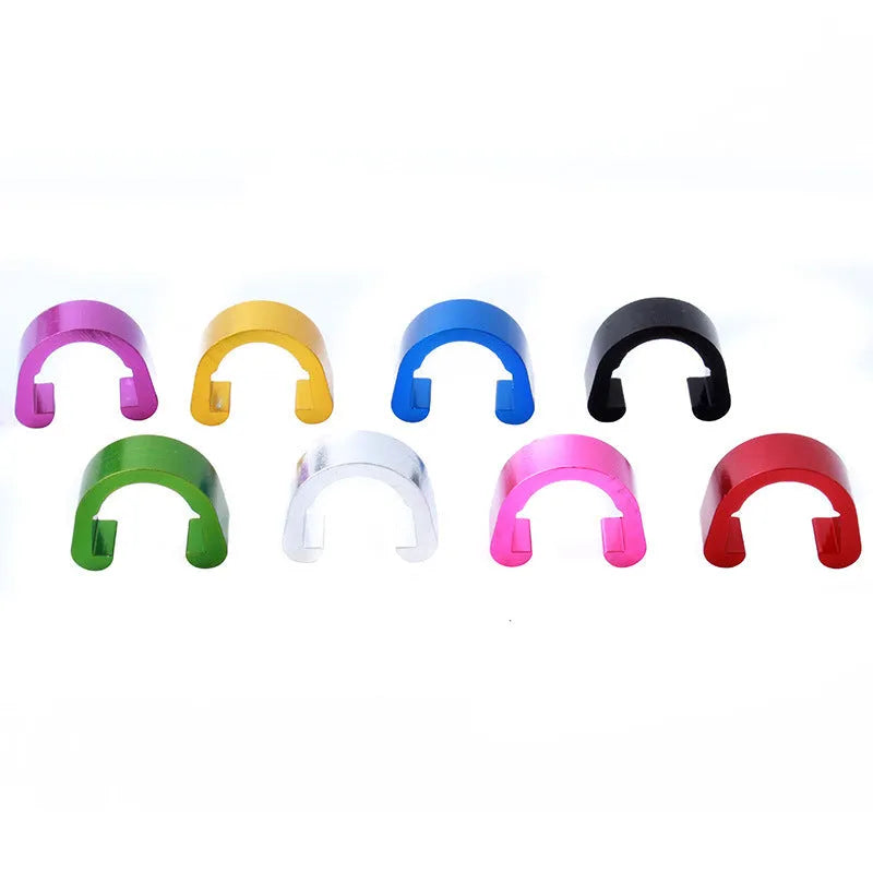 Ten small aluminium C-shaped buckles in assorted colours including black, blue, gold, and red.