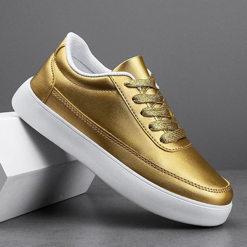 Women's gold leather lace-up flat casual shoes on a white background.