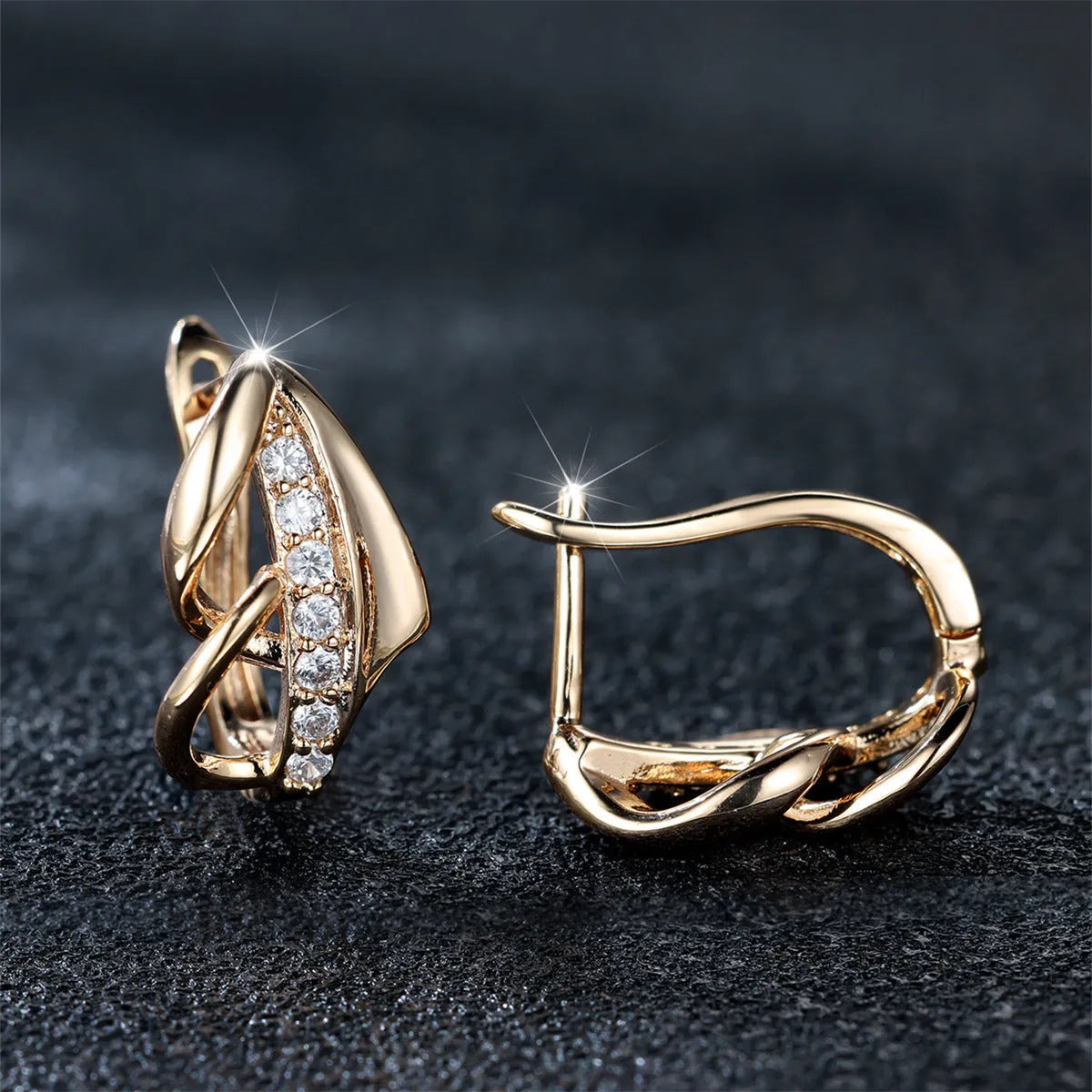 Copper geometric arrow ear clip in champagne gold with white diamond accent