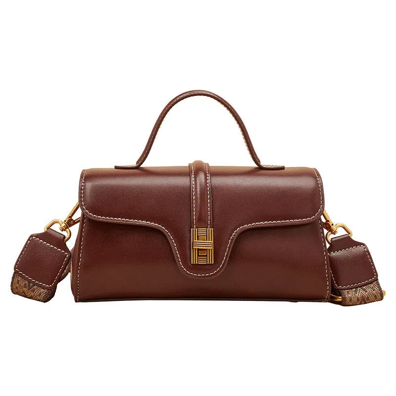 Cambridge-style leather messenger bag in clamshell design with lock detail and internal compartments