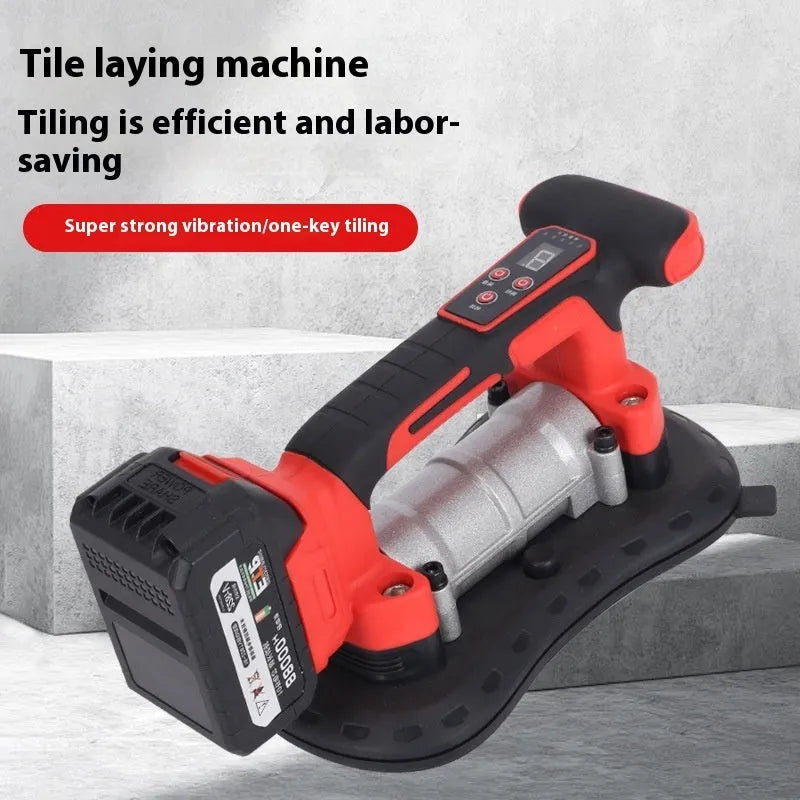 Cordless tile laying machine with battery, shown handling a large format tile