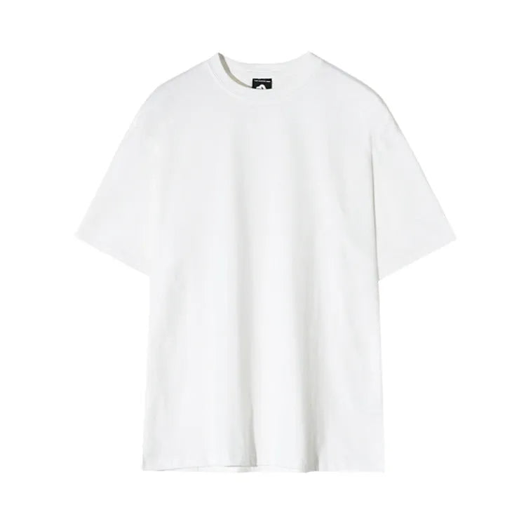 Men's slim fit black cotton t-shirt with round neck and half sleeves on a model.