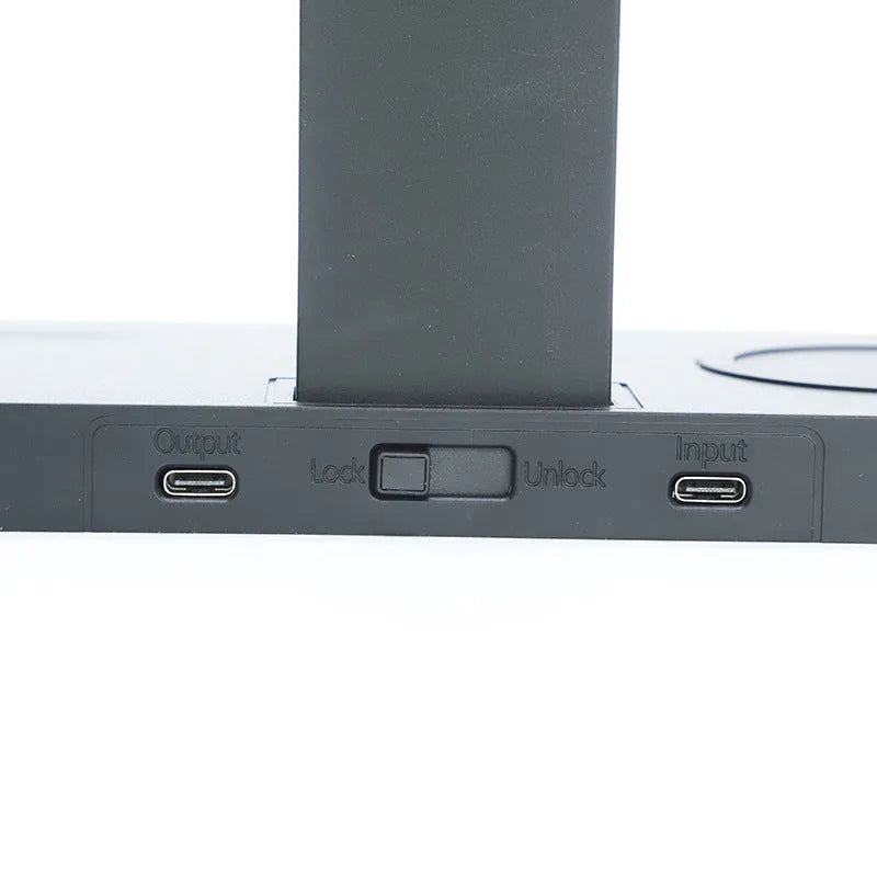 Black wireless charging station bracket for mobile phone, smartwatch, and headset.