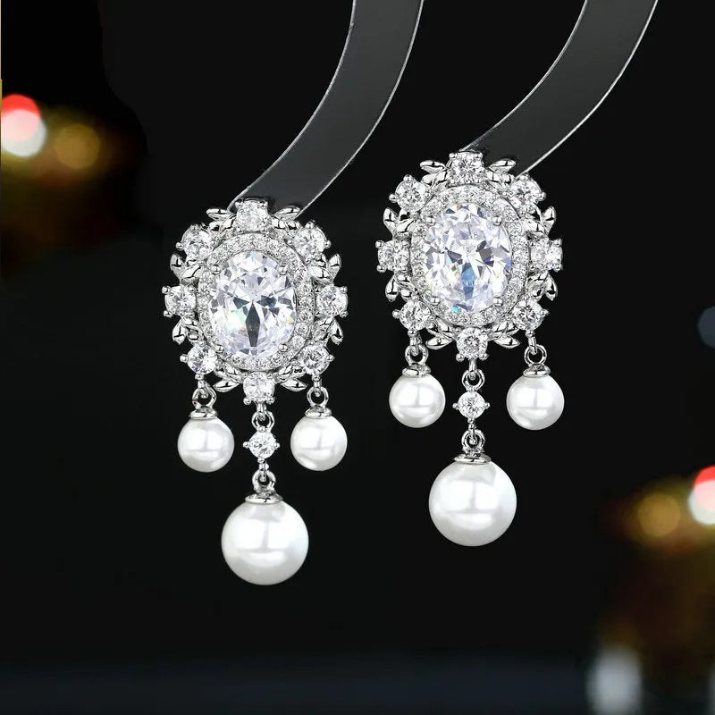 Oval geometric copper earrings with zircon inlay and pearl tassel in pink, blue, purple and white colours