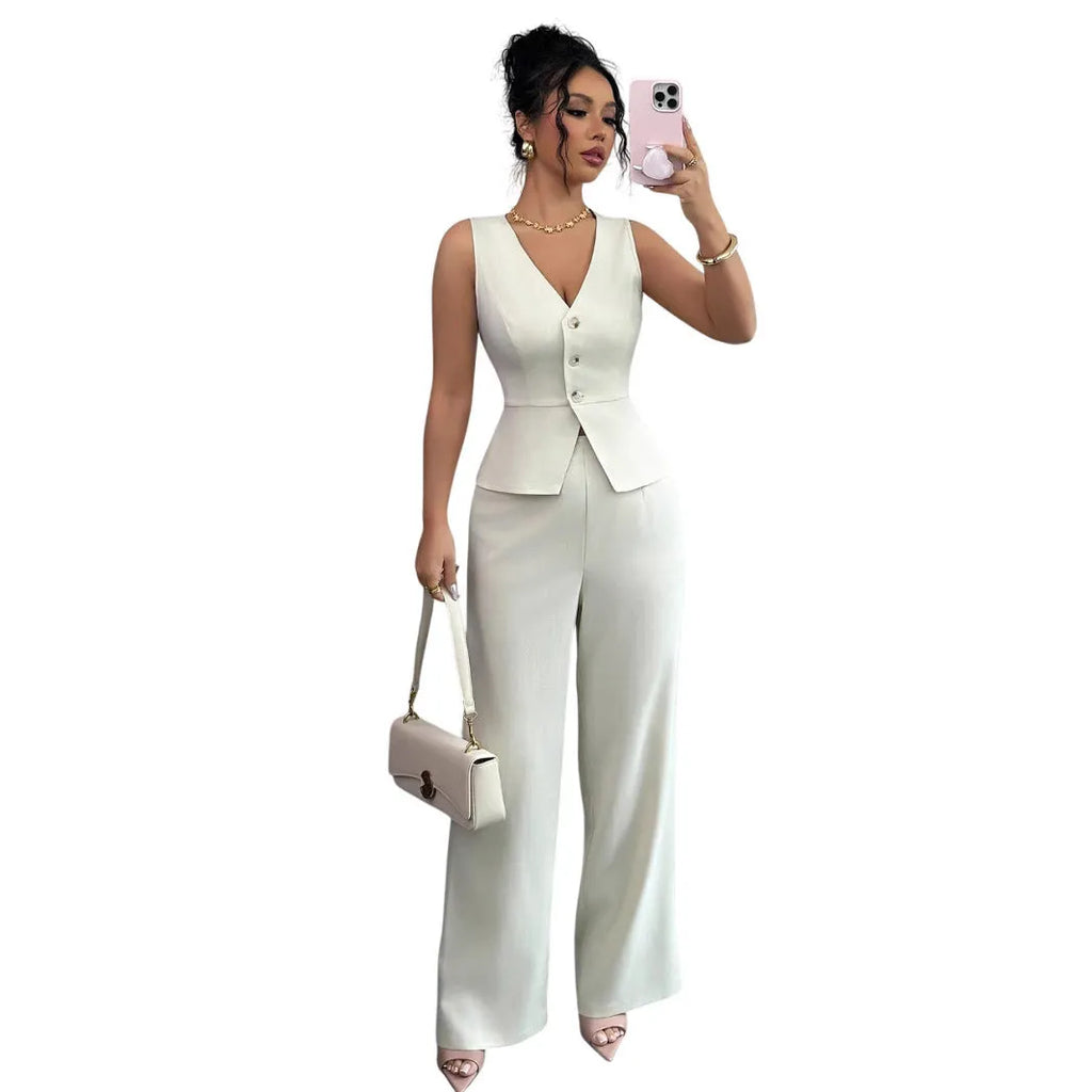 Women's solid colour sleeveless vest and high-waist trousers two-piece set in polyester fabric.