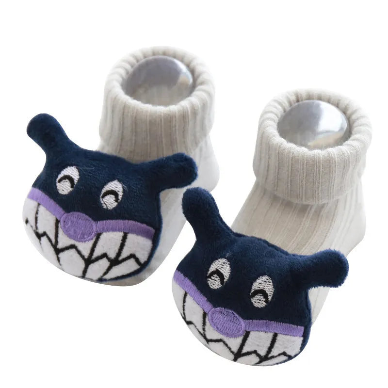 Cotton baby floor socks in a pink bow pattern, shown on an infant's feet.