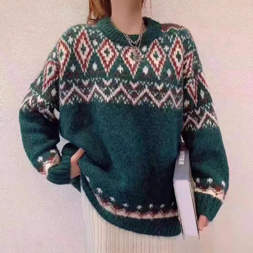 Red and white striped women's loose long-sleeve pullover knitted top on a hanger.