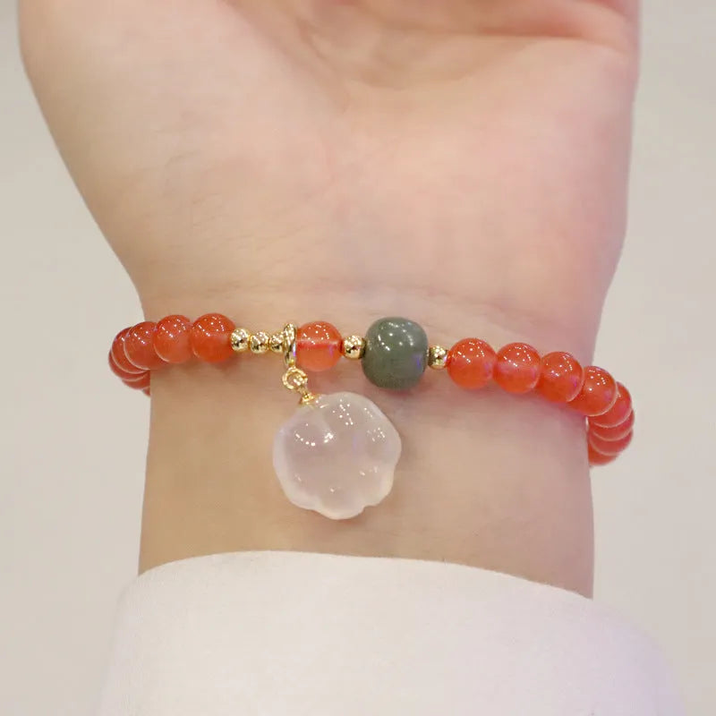 Natural red agate bracelet with 6mm beads and 8mm cat paw charm featuring gemstone inlay