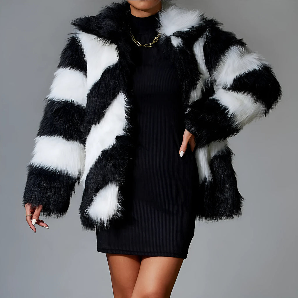 A minimalist faux fur coat with contrast lapels and a detachable fur collar, shown in picture colour.