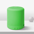 Small A11 wireless stereo speaker in black, pink, blue, or green colours on a surface.